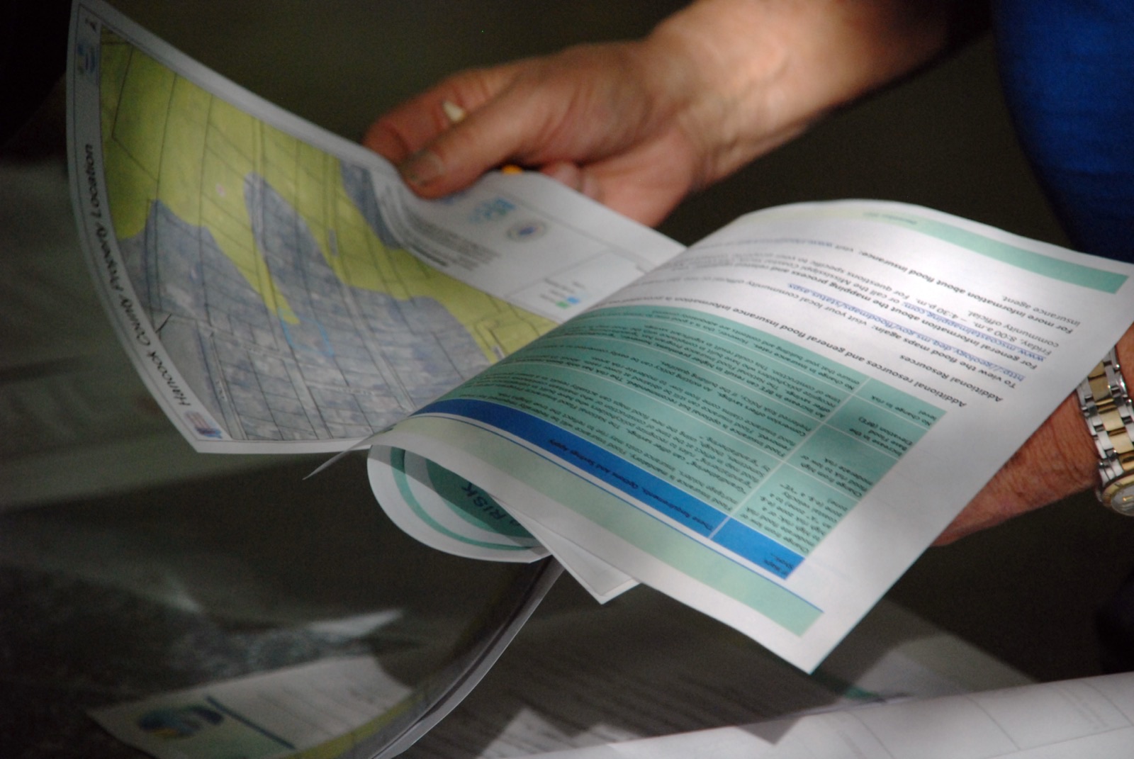 A resident reviews new preliminary FEMA flood map information at a community open house