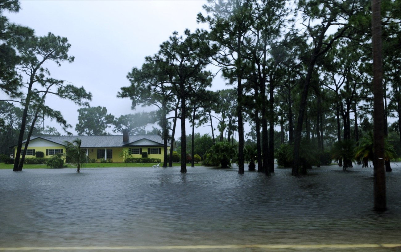 Floodwater from a storm covering a residential neighborhood, the kind of damage flood insurance covers